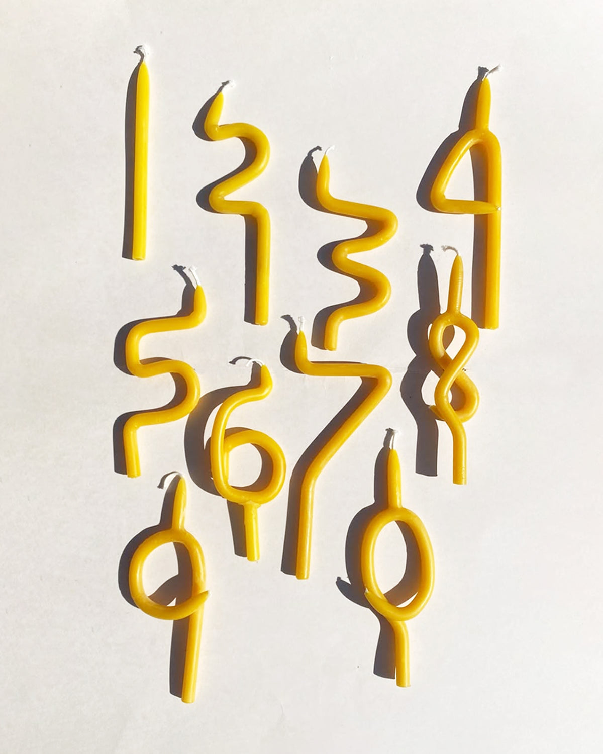 Poppy and Sage number and Squiggle candles
